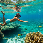 **

"A fully clothed couple snorkeling in the Tobago Cays, surrounded by colorful fish and coral, clear turquoise water, bright sunny day, perfect anatomy, correct proportions, well-formed hands, proper finger count, natural pose, safe for work, appropriate content, professional, modest, family-friendly."

**